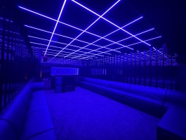 Immersive ceiling light grid reflected in mirrored walls at COVA Club Paris