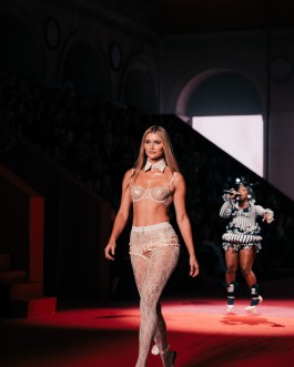 Model and performer on the ETAM Live Show 2025 runway in Paris